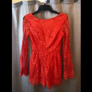 New with tags, never worn. Long sleeve romper.